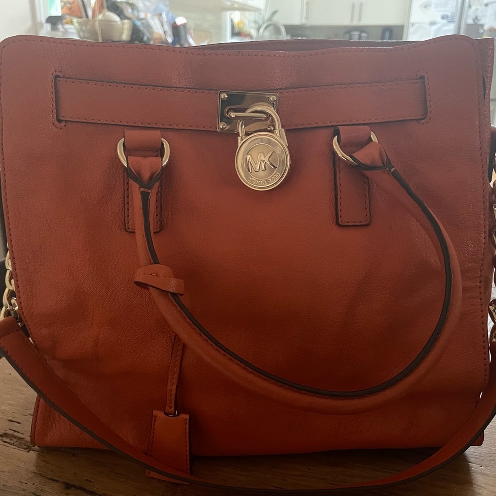Gorgeous Michael Kors bag. Gol detail - buckle, locks and chain strap. Like new!